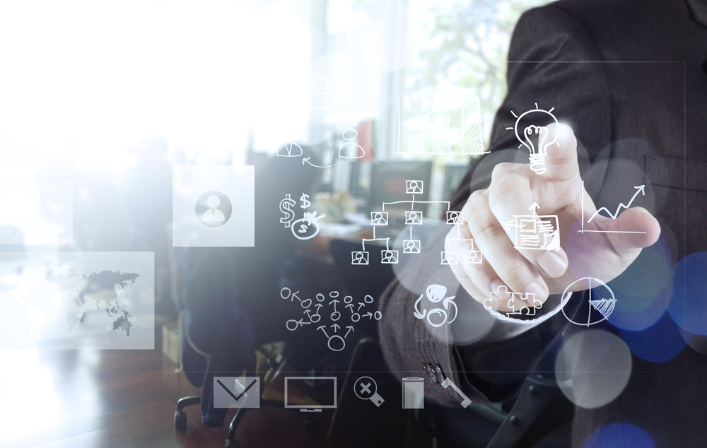 businessman hand drawing creative business strategy with light bulb as concept and bokeh exposure